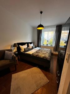 a bedroom with a bed and a window at Apartments Vogtlandblick in Reichenbach im Vogtland