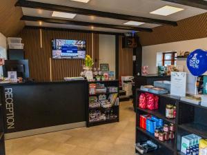 a store with a cash counter in a store at DCU-Camping Åbyskov Strand in Åbyskov