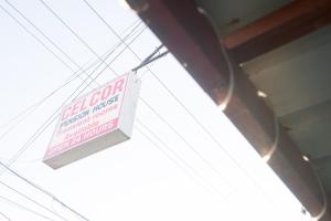 a sign that is hanging from some wires at CELCOR PENSION HOUSE in Cabatuan +2 photos