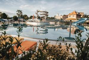 a large swimming pool with a water slide at New apartment Eva in Jicin, 2 bedrooms and balcony, Czech Paradise in Jičín