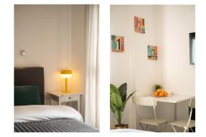 a bedroom with a bed and a table with oranges on it at Assuta studio in Tel Aviv