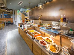 a buffet line with many plates of food at Hotel Oak Shizuoka in Shizuoka