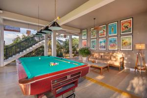 a living room with a pool table and a couch at Serene Park Hotel By Ark in Tissamaharama
