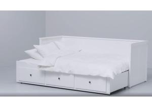 a white bed with white sheets and pillows at Cosy guesthouse in peaceful garden surroundings in Silkeborg
