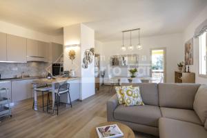 a living room and kitchen in a apartment at Raphael's Boutique Stay in Palau