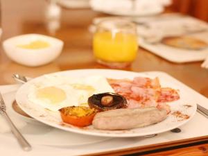 a plate of breakfast food on a table at Belle Vue in Queenstown