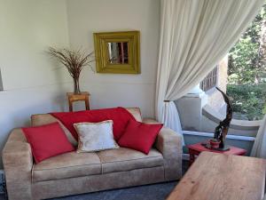 a living room with a couch and a table at Belle Vue in Queenstown