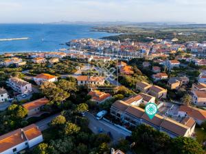 an aerial view of a city and the ocean at Villino Joy in Stintino