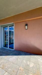 a building with a light on the side of it at Casa Belfiore in Maccagno Superiore