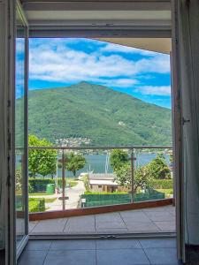 a view of a mountain from a window of a house at Casa Belfiore in Maccagno Superiore +37 photos