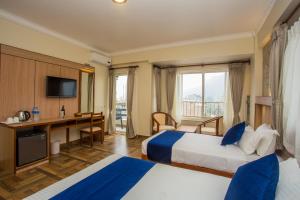 Postel nebo postele na pokoji v ubytování Hotel White Pearl