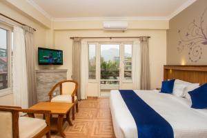 Postel nebo postele na pokoji v ubytování Hotel White Pearl