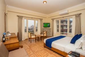 Postel nebo postele na pokoji v ubytování Hotel White Pearl