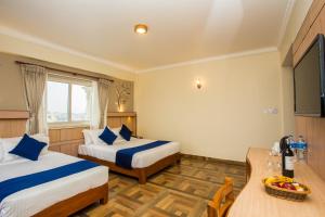 Postel nebo postele na pokoji v ubytování Hotel White Pearl