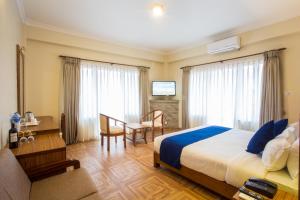 Postel nebo postele na pokoji v ubytování Hotel White Pearl
