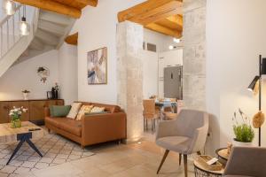 a living room with a couch and a table at MERAKI residence in Atsipopoulo