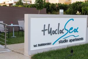 a sign for a flitz set studio apartments at ThalaSea Studio - Apartments in Mytikas