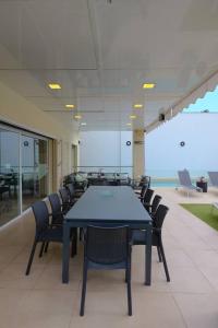a conference room with a blue table and chairs at August Villa Málaga. Relax Playa Piscina Coworking in Málaga