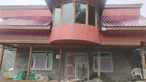 a house being built with a red roof at Paris Home Stay in Keran