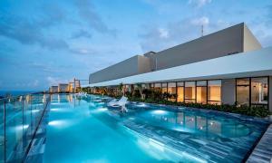 a swimming pool on the roof of a building at CĂN HỘ NGHĨ DƯỠNG CAO CẤP THE SÓNG VŨNG TÀU-THE SONG APARTMENT LeeHuy in Vung Tau