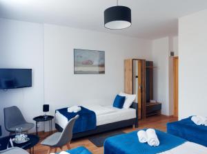 a hotel room with a bed and a tv at Hotel Tor Kielce in Kielce