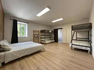 a bedroom with two beds and two bunk beds at Elizetxea in Larceveau-Arros-Cibits +75 photos