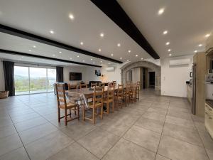 a large dining room with a table and chairs at Elizetxea in Larceveau-Arros-Cibits