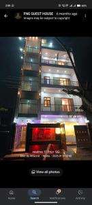 a picture of a building with lights on it at Fng Guest House in Noida