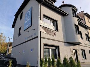 a building with signs on the side of it at Noclegi Bielawa in Bielawa