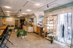a room with a store with a table and chairs at Coucou House Gra in Toyooka +29 photos