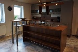 a kitchen with a sink and a counter at Leuchtturmnest in Krummhörn