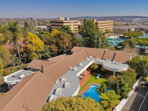 an aerial view of a house with a swimming pool at HOSPITALity Lodges in Johannesburg