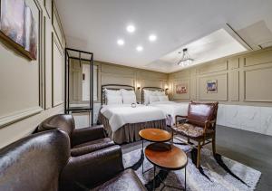 a hotel room with a bed and a couch at Browndot Hotel Daegu Exco branch in Daegu