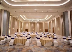 a banquet hall with tables and chairs in a room at Vinaika Eco-Resort in Rānchī +30 photos