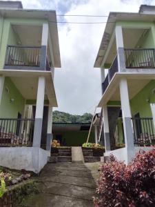 a building with stairs and balconies on it at Irene in Kelimutu