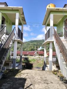 a view of the front of a building with stairs at Irene in Kelimutu