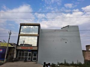 a building with a large window on the side of it at Sivago hotel in Kosi