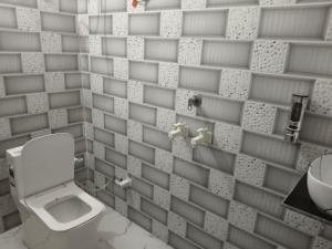 a bathroom with a toilet and a sink at Sivago hotel in Kosi