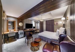 a hotel room with a bed and a desk at Browndot Hotel Daegu Exco branch in Daegu