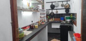 a small kitchen with a counter and a sink at Villa Culture in Ile aux Nattes