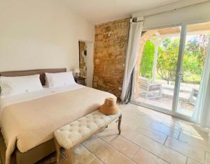a bedroom with a bed and a large window at Masseria Vittoria in Acaya +120 photos