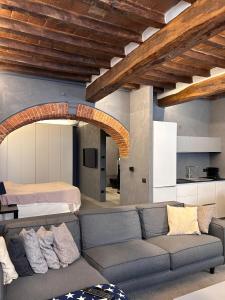 a living room with a couch and a bed at G11 Carpi in Carpi