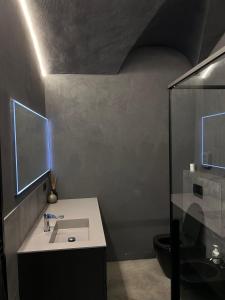 a bathroom with a sink and a toilet at G11 Carpi in Carpi