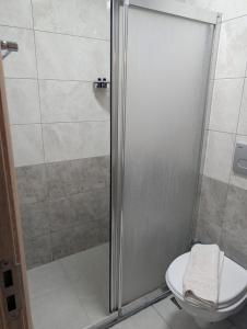 a shower stall with a toilet in a bathroom at Retro Boutique in Istanbul