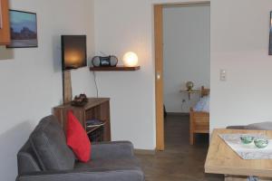 a living room with a couch and a table at Ferienhof Leuner Sandro in Bad Schandau
