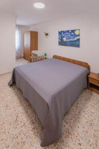 a bedroom with a large bed in a room at Casaverde Gargano in Mattinata +21 photos