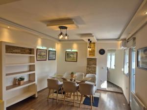 a dining room with a table and chairs at Panorama Apartment in Belgrade