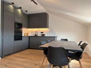 a kitchen and dining room with a table and chairs at Villa Barbara in Split