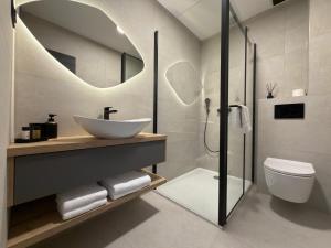 a bathroom with a sink and a toilet and a mirror at Villa Barbara in Split +70 photos