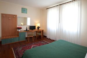 Postel nebo postele na pokoji v ubytování Hotel Valbrenta